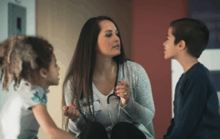 school nurse evaluating two children