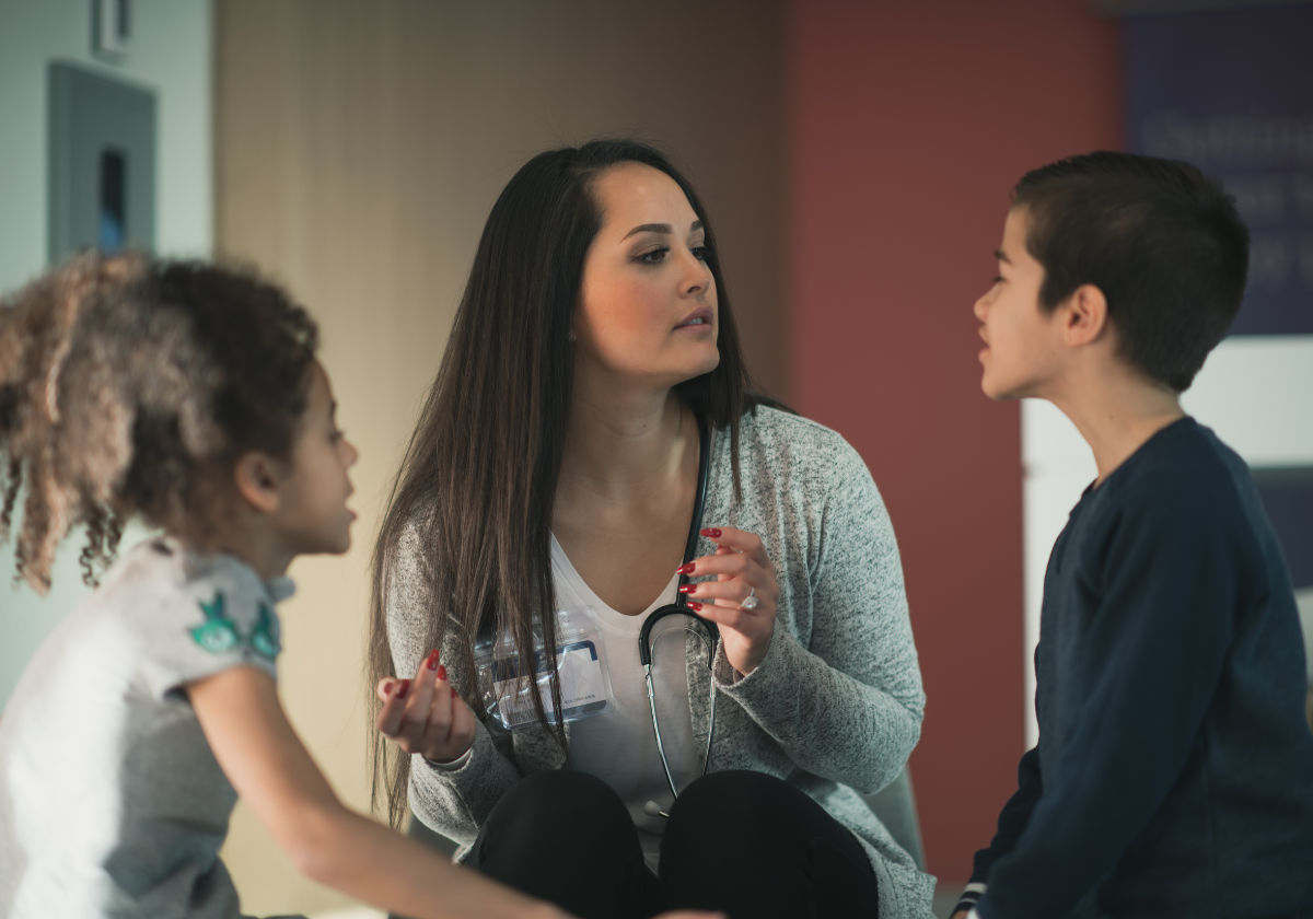 School Nurse school nurse evaluating two children